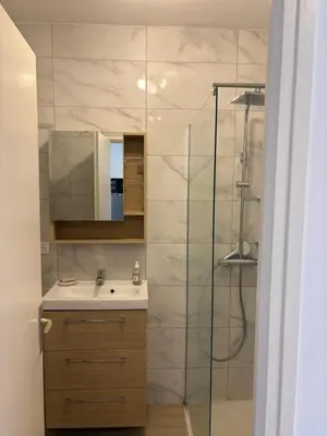 a bathroom with a sink and a shower at Studio Moderne Cannes - Parking - Proche de la plage in Cannes