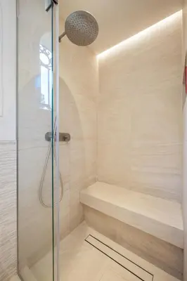 a bathroom with a shower with a glass door at Villa Grand Largue - vue mer 180° in Cannes