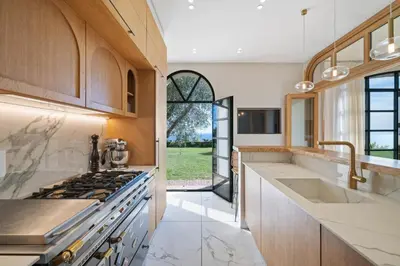 a kitchen with a sink and a stove at Villa Grand Largue - vue mer 180° in Cannes