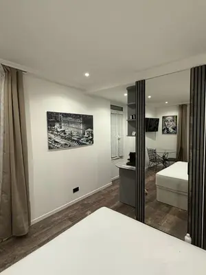 a bedroom with a bed and a mirror at Ref PINSON in Cannes