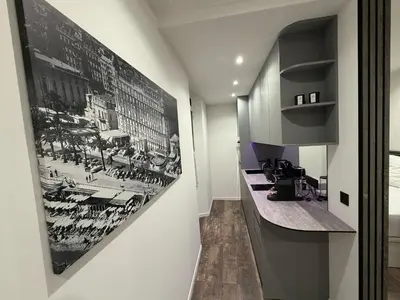 a bathroom with a poster of a battle on the wall at Ref PINSON in Cannes