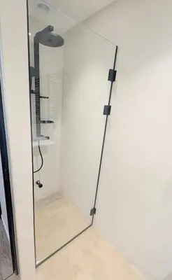 a shower with a glass door in a bathroom at Ref PINSON in Cannes