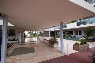 an external view of a building with a courtyard at Luxury 1 Bed Apt Seafront Escape in Cannes in Cannes