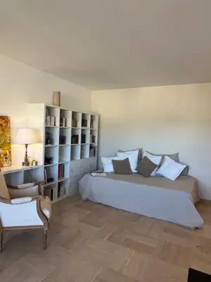 a bedroom with a large white bed and a chair at Celeste Cannes Centre 700m du Palais des Festivals in Cannes