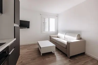 a living room with a couch and a table at Perfect studio in Cannes in Cannes