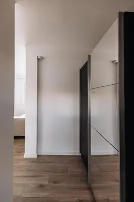 a room with a large glass cabinet and a bedroom at Perfect studio in Cannes in Cannes