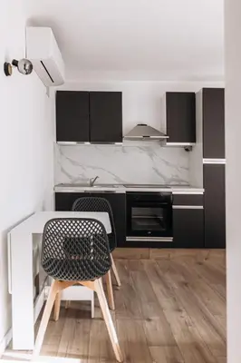 a kitchen with a table and a chair at Perfect studio in Cannes in Cannes