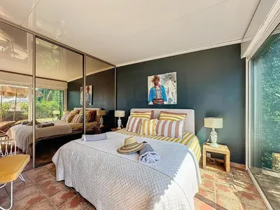 a bedroom with a bed and a couch at Intuition Rooftop vaste terrasse in Cannes