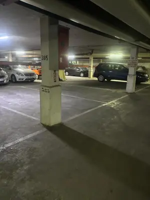 a parking lot with cars parked in a parking garage at magnifique 2 pièces parc de la croisette in Cannes