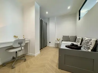 a bedroom with a bed and a desk and a desk at Cannes Évasion by SCLS Locations in Cannes