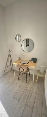 a room with a desk with a camera and a mirror at F3 ground floor, Hypercentre 2 min from Palace in Cannes