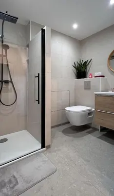 a bathroom with a shower and a toilet and a sink at Studio 3étoiles à 10 min du Centre - Calme in Cannes