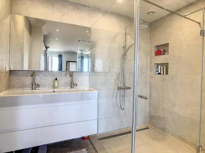 a bathroom with a sink and a shower at Pura Vida in Cannes