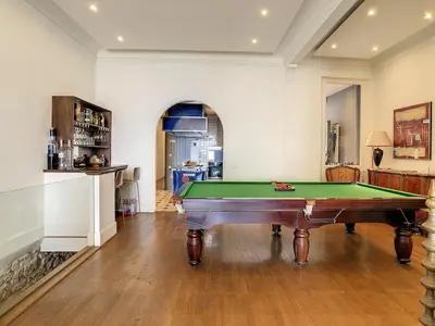 a living room with a pool table in it at Pura Vida in Cannes