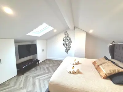 a bedroom with a bed with two teddy bears on it at Luxury 3 bed 2 bath flat Cannes Croisette in Cannes
