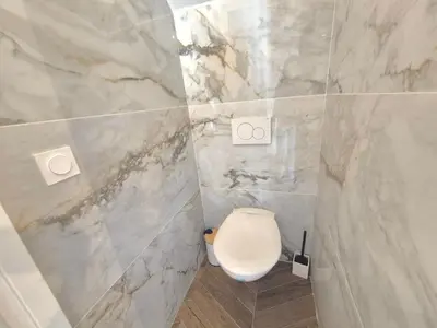 a bathroom with a white toilet in a shower at Luxury 3 bed 2 bath flat Cannes Croisette in Cannes