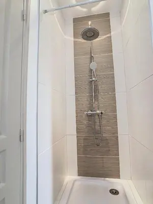 a shower with a shower head in a bathroom at Villa Bamboo in Cannes