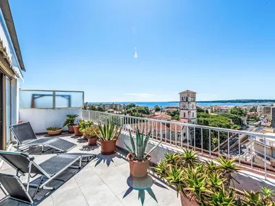 a balcony with chairs and plants on a building at Apartment Le Katia-2 by Interhome in Cannes