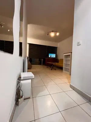 a living room with a tiled floor and a couch at Large Studio in Cannes near la Croisette and beach in Cannes