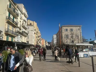 a group of people walking down a city street at Aparthotel Seaside Cannes Festival Suite in Cannes