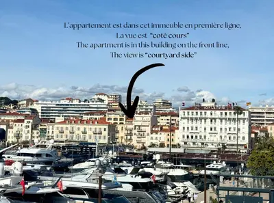 a group of boats in a harbor with buildings at Aparthotel Seaside Cannes Festival Suite in Cannes