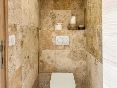 a bathroom with a toilet and towels on the wall at Cannes centre - 10mn Palais, Croisette, Plage - CY in Cannes