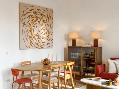 a living room with a wooden table and chairs at Cannes centre - 10mn Palais, Croisette, Plage - CY in Cannes