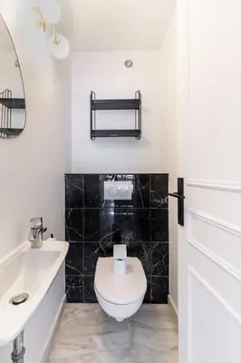 a bathroom with a white toilet and a sink at Luxurious Apartment with Sea and Carlton View in Cannes