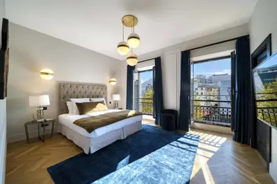 a bedroom with a bed and a large window at REF 1392 - Cannes palais des festivals apartment for rent in Cannes