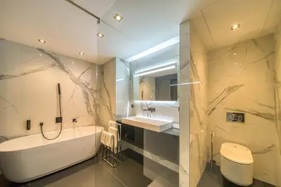 a bathroom with a tub and a sink and a toilet at REF 1392 - Cannes palais des festivals apartment for rent in Cannes