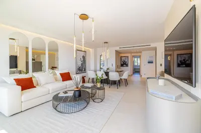 a living room with a couch and a table at REF 1981 - Cannes sea view apartment Cannes Palm Beach in Cannes