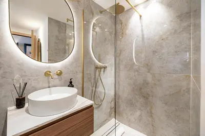 a bathroom with a sink and a mirror at REF 1980 - Cannes palm Beach sea view in Cannes