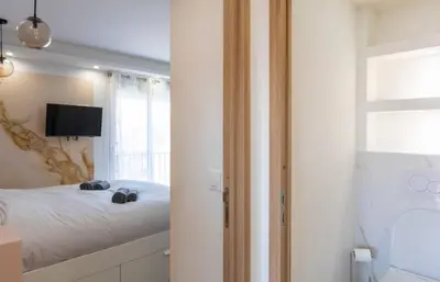 a bedroom with a bed with two shoes on it at Les YUCCAS - 2 pièces Suquet Parking Vue Mer pour 4 personnes in Cannes