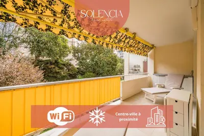 a balcony with a yellow and red sign on it at 3 pièces au calme avec terrasses et verdure in Cannes