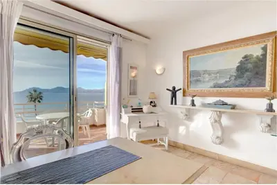 a living room with a view of the ocean at Appartement 2 pièces - Vue mer in Cannes