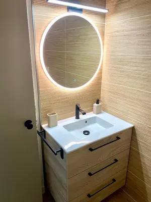 a bathroom with a sink and a mirror at Cosy Studio Cannes in Cannes