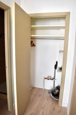 a room with a closet and a desk at Cosy Studio Cannes in Cannes