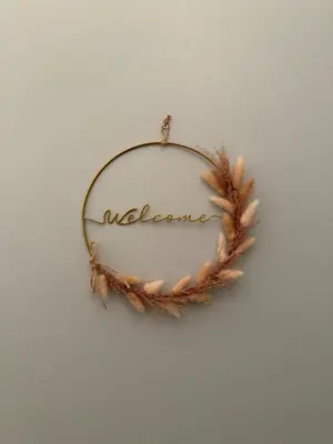 a wreath with the word welcome on a wall at Superbe 2P, clim, terrasse au calme, tout à pied in Cannes