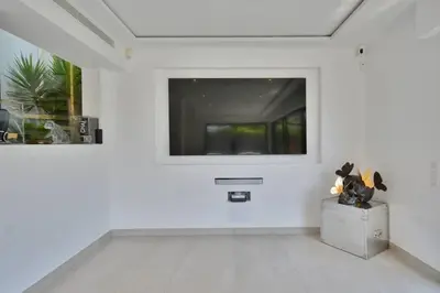 a living room with a blue couch and two blue chairs at Villa Bella Vista - Luxe - Piscine et Sérénité au Cœur du Cannet in Le Cannet