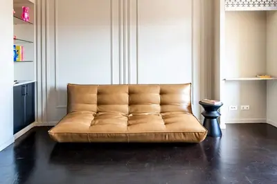 a kitchen and living room with a couch and a table at 