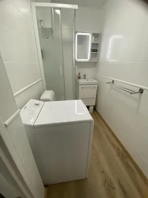 a white bathroom with a toilet and a sink at Studio cosy Cannes à 250 m de la plage, pointe Croisette in Cannes