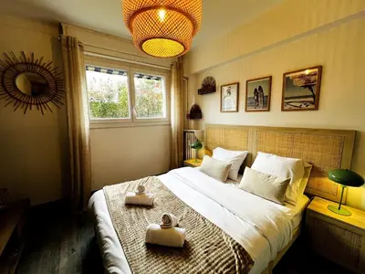 a bedroom with a bed with two towels on it at Golden Beach Studio Cannes in Cannes