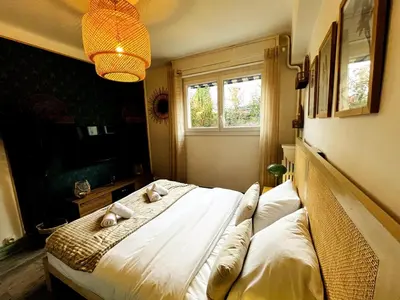 a bedroom with a bed with pillows and a window at Golden Beach Studio Cannes in Cannes