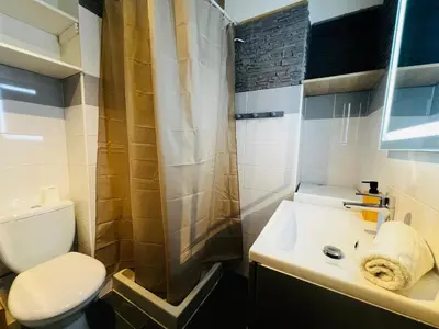 a bathroom with a toilet and a sink and a shower at Golden Beach Studio Cannes in Cannes