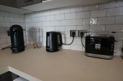 a kitchen counter with two toasters and a toaster at Palm beach apartment with swimming pool in a residence in Cannes