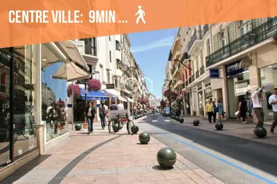 a city street with people walking down the street at Le Tassigny #Central #Quiet #Air conditioning #Wifi in Cannes