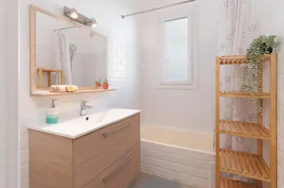 a bathroom with a sink and a bath tub at Le Tassigny #Central #Quiet #Air conditioning #Wifi in Cannes
