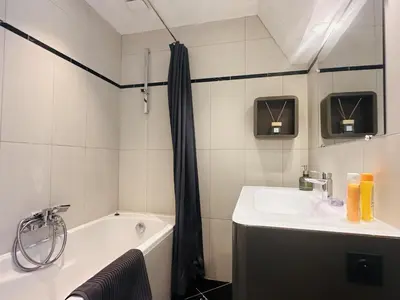 a bathroom with a sink and a bath tub at One bedroom apartment with a sea view right by the Croisette beaches and the center of Cannes. - 2287 in Cannes