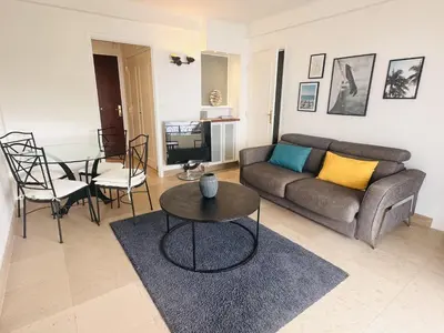 a living room with a couch and a table at One bedroom apartment with a sea view right by the Croisette beaches and the center of Cannes. - 2287 in Cannes