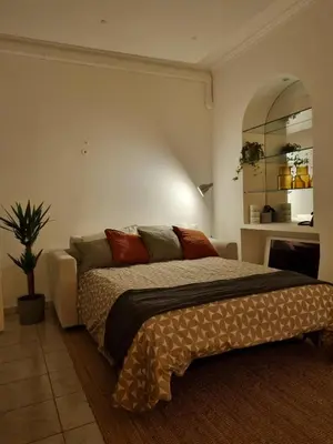 a bedroom with a bed and a potted plant at Bright one bedroom apartment in the center of Cannes13 minutes walk to the Palais des Festivals - 2290 in Cannes